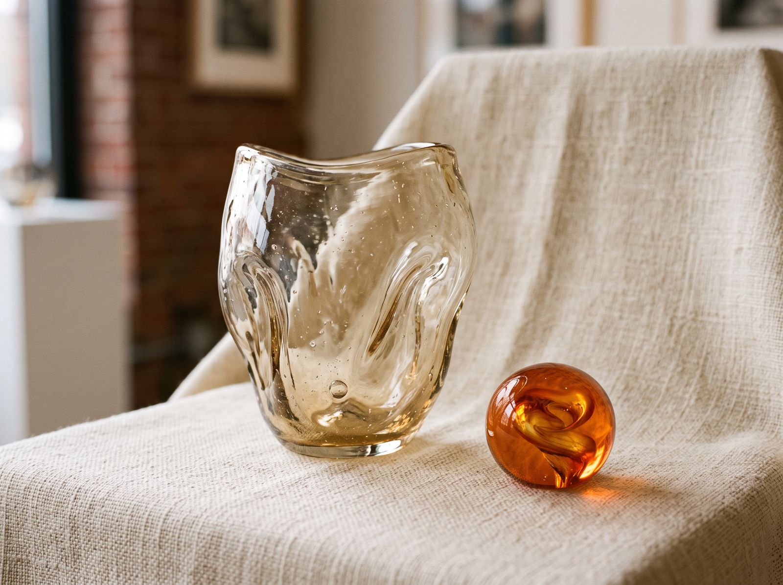 Freeform pale vase with an ember orb paperweight
